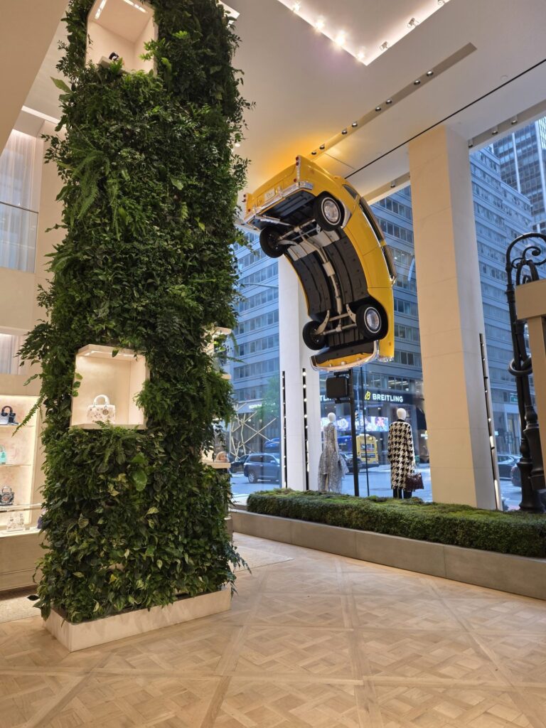 Suspended vehicle display installed inside a Manhattan retail interior